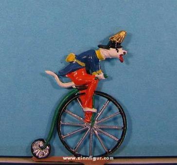 Dog on penny-farthing, dressed up funny 